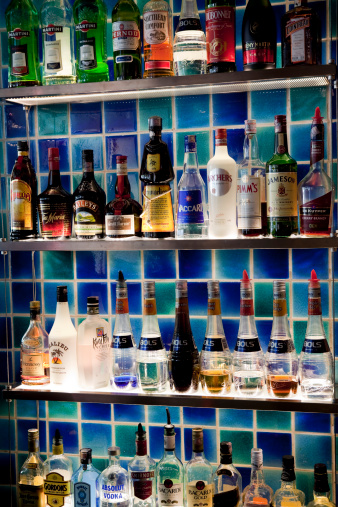 Kuala Lumpur, Malaysia - March 4, 2011: Display of liquor bottles on a bar shelf inside Delucca a trendy restaurant located in the Bukit Bintang area of Kuala Lumpur, Malaysia. Bukit Bintang is a popular nightlife area.