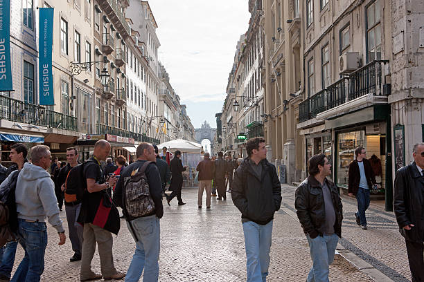 Lisbon, Portugal- November 23, 2011: Tourists and locals walking on Rua Agusta, one of the main shopping streets of downtown Lisbon.