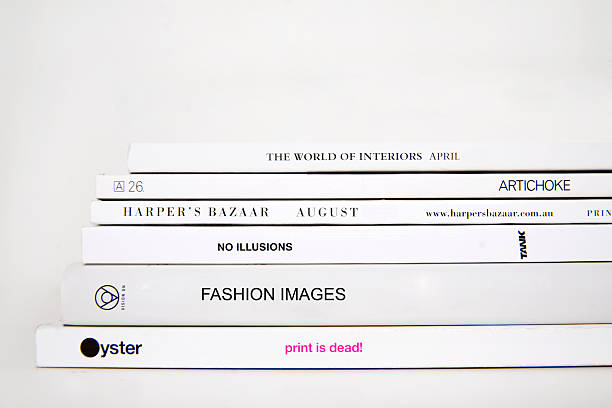 fashion magazine stack on white background stock photo