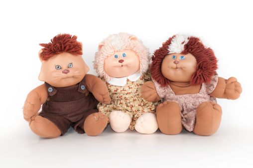 Phoenix, United States - July 25, 2011:  The Cabbage Patch Kids line of dolls as manufactured by Coleco in the 1980's was a must-have Christmas gift.  These are three Koosa stuffed toy cats, the animal version of the popular dolls.