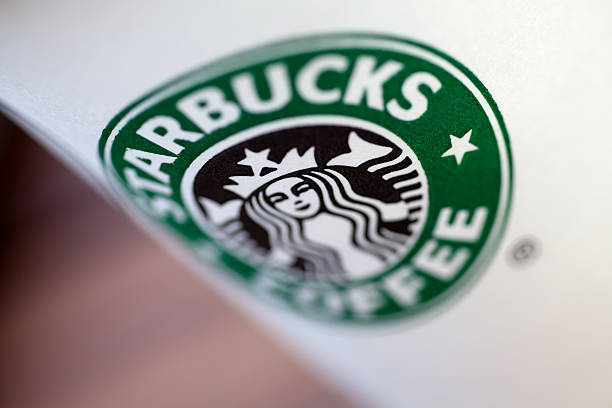 izmir, Turkiye - June 1, 2011: one starbucks coffee cup. Starbucks is the world\\'s largest coffeehouse company. The cup in the center shows the old version of the logo details.