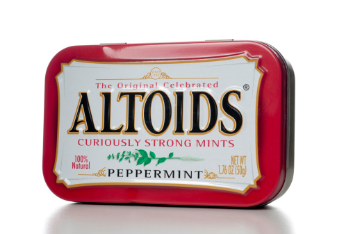 Miami, USA - October 30, 2011: Altoids Curiously Strong Mints Peppermint flavor 1.76 OZ tin. Altoids is own by Wrigleys and are a breath mints brand.