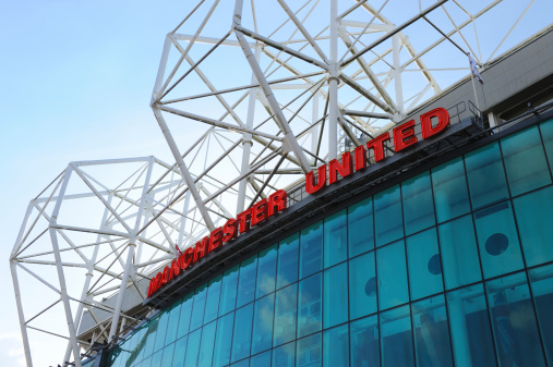 Manchester, England - March 1st, 2011: The east stand of Old Trafford football stadium, home of Manchester United. With space for 75,957 spectators, Old Trafford has the second-largest capacity of any English football stadium after Wembley Stadium.