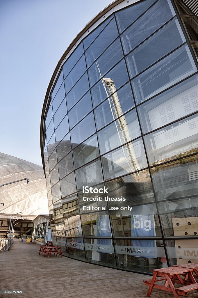 Glasgow Science Centre Glasgow, UK - April 26, 2011: The glass facade of the IMAX theatre at Glasgow's Science Centre reflects the Science Tower. Aluminum Stock Photo