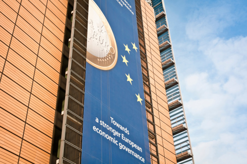 Brussels, Belgium - December 11, 2011: EU campaign to support a stronger economic governance during financial crisis of 2011. The ads is standing on the facade of Berlaymont, building that host the European commission in Brussels, Belgium