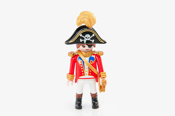Playmobil Pirates Captain "Muenster, Germany - November 8, 2011: Playmobil Pirates Captain on white background. Playmobil are famous construction toys manufactured by the Brandstaetter Group, headquartered in Zirndorf, Germany." swashbuckler stock pictures, royalty-free photos & images