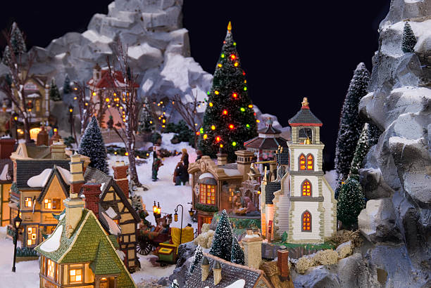 Decorative christmas village with Charles Dickens theme Brummen, Netherlands - December 25, 2010: Decorative christmas village with Charles Dickens theme. The houses and figurine are made by Department56 and Lemax. Two companies specialised in christmas decorations. charles dickens stock pictures, royalty-free photos & images
