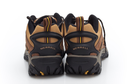 Trebnje, Slovenia, - November 06, 2011: Merrell brand hiking shoes, photographed in the studio on a white background