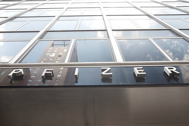 Pfizer Manhattan, New York USA - July 9, 2011: Pfizer letter sign on the building's Headquarters. Pfizer's is the largest pharmaceutical company in the world. pfizer stock pictures, royalty-free photos & images