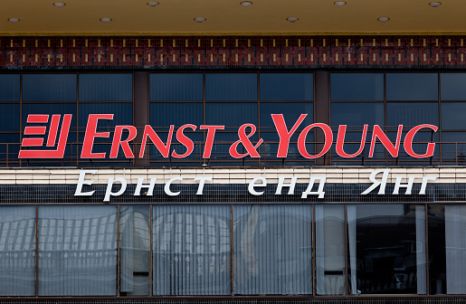 Kiev, Ukraine - August 24, 2011: Logo of Ernst and Young at the facade of their office building in Kiev. It is a one of the largest professional services and accountancy firms in the world.