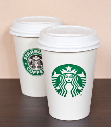 Budapest, Hungary - November 9, 2011: Starbucks paper coffee cups with the old and the redesigned new logo.