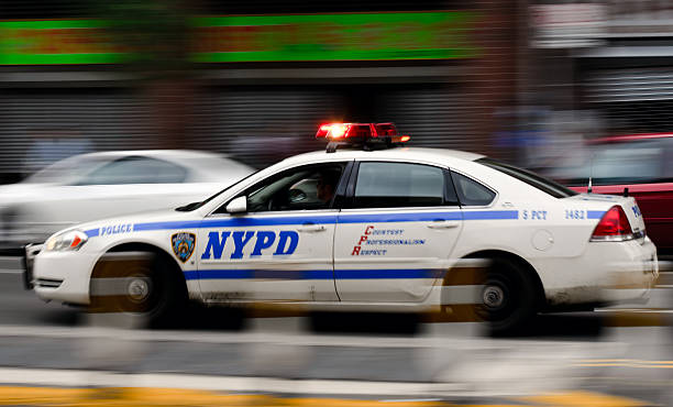 New York City Police Car Speeding along Columbus Avenue New York City, USA - June 14, 2011: New York City Police Car Speeding along Columbus Avenue columbus avenue stock pictures, royalty-free photos & images