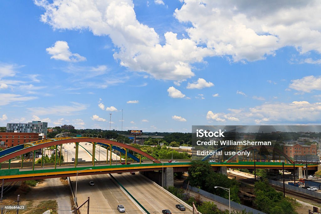 Baltimore Maryland Colorful Howard Street Bridge Baltimore, MD, USA - July 14, 2011: Elevated view of the multi-colored Howard Street Bridge in the Mount Vernon area of downtown Baltimore.  This is a twin steel arch-style bridge that crosses over the Jones Falls Expressway, the CSX and Northern Central Railway, and Falls Road. The bridge was built in 1938 by the J. E. Greiner Company to replace an earlier 19th century iron arch bridge.  The bridge is 979 feet long and has been painted in multiple colors. Maryland - US State Stock Photo