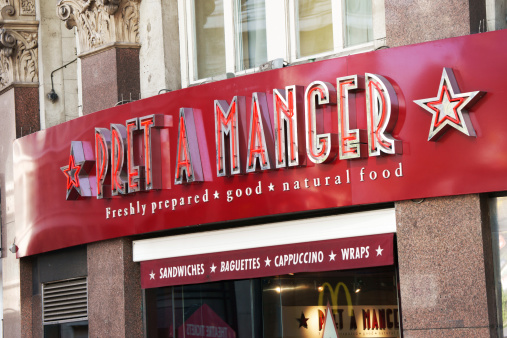 London, United Kingdom - May 4, 2011: Typical red Pret A Manger restaurant sign with stars in London. Pret A Manger was first opened in London in 1986 by college friends, Sinclair and Julian. There are around 265 shops worldwide known for great sandwiches.