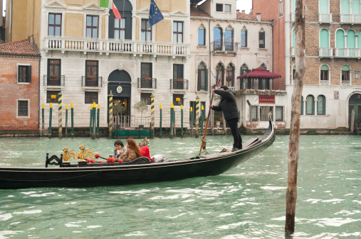 Gondola on Canal Grande in Venice, in a beautiful summer day