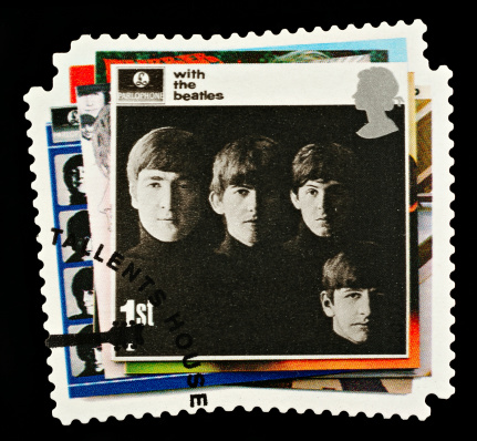 Exeter, United Kingdom - March 07, 2010: British Postage Stamp showing The With The Beatles Album Cover showing the Four Members of the Beatles Pop Group, circa 2007