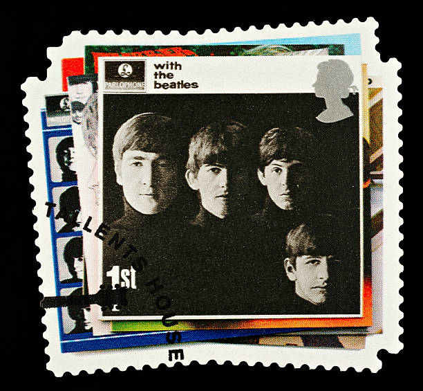 Beatles Pop Group Postage Stamp Exeter, United Kingdom - March 07, 2010: British Postage Stamp showing The With The Beatles Album Cover showing the Four Members of the Beatles Pop Group, circa 2007 beatles stock pictures, royalty-free photos & images