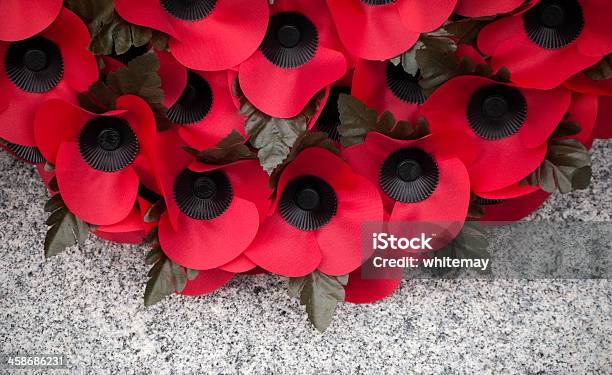 Poppy Wreath On A Stone War Memorial Stock Photo - Download Image Now - Remembrance Day, Remembrance Sunday, Poppy - Plant