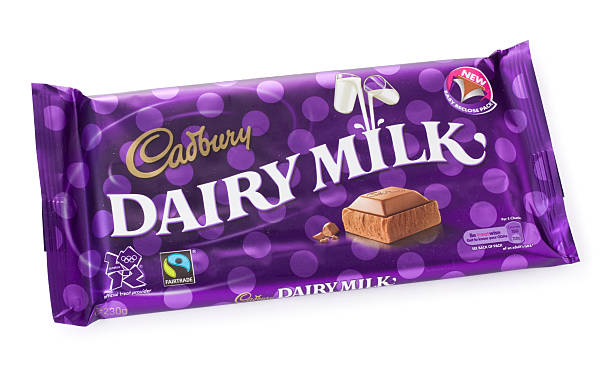 Large Cadbury Dairy Milk chocolate bar St Ives, England - August 15, 2011: A 230g Cadbury Dairy Milk Chocolate Bar isolated on a white background. cadbury plc photos stock pictures, royalty-free photos & images