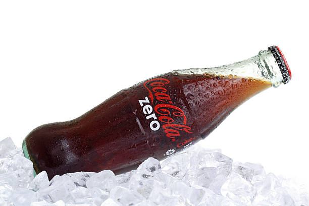 Coca-Cola Zero Bottle on Ice Izmir, Turkey - July 2, 2011: Coca-Cola Zero bottle on ice. Coca-Cola is a carbonated soft drink sold in the stores, restaurants, and vending machines of more than 200 countries. It is produced by The Coca-Cola Company of Atlanta, Georgia coke zero photos stock pictures, royalty-free photos & images
