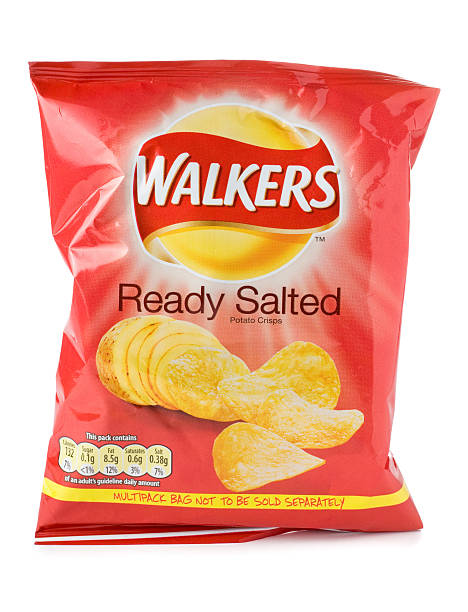 Packet of Walkers ready salted crisps on a white background St Ives, England - August 15, 2011: A 25g bag of Walkers Ready Salted crisps from a multi-pack isolated on a white background. Walkers is a British snack food manufacturer owned by Frito-Lay, a subsidiary of PepsiCo. lays potato chips stock pictures, royalty-free photos & images