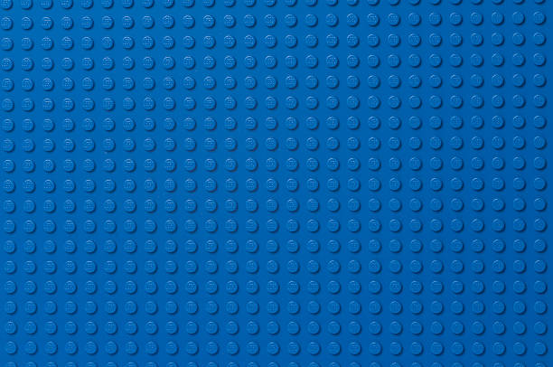 Lego blue baseplate "Ski, Norway - February 27, 2012: Lego blue baseplate. The Lego toys were originally designed in the 1940s in Denmark and have achieved an international appeal." lego stock pictures, royalty-free photos & images