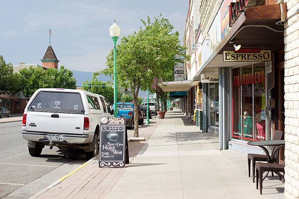 Delta, Colorado, USA - June 1, 2011: small town western Colorado AmericanaRural Americana small town street view and sidewalk coffee shop business early summer featuring a view of small town America and related commerce and life in Western Colorado