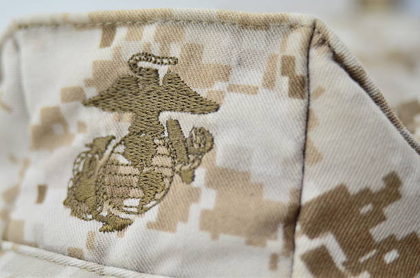 Marine Corps Logo, Desert Patrol Cap "San Diego, California, United States - March 19th 2012: The Marine Corps Emblem on a patrol cap worn 2011 in Helmand, Afghanistan during Operation Enduring Freedom, shot in studio." us marine corps stock pictures, royalty-free photos & images