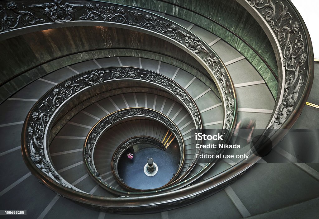 Stairway in Vatican Museum Rome, Italy - 11 September, 2010: The old stairway inside the Vatican museum with moving people in Rome, Italy Vatican Stock Photo