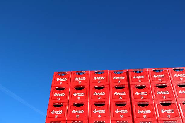 Crates of Budweiser Budvar beer Budweis, Czech Republic - November 3, 2012: Crates of beer, brand Budvar in the Budweiser Brewery in Ceske Budejovice (Budweis), Czech Republic against blue sky. The Budweiser Budvar beer is brewed only in Ceske Budejovice (Budweis). cesky budejovice stock pictures, royalty-free photos & images