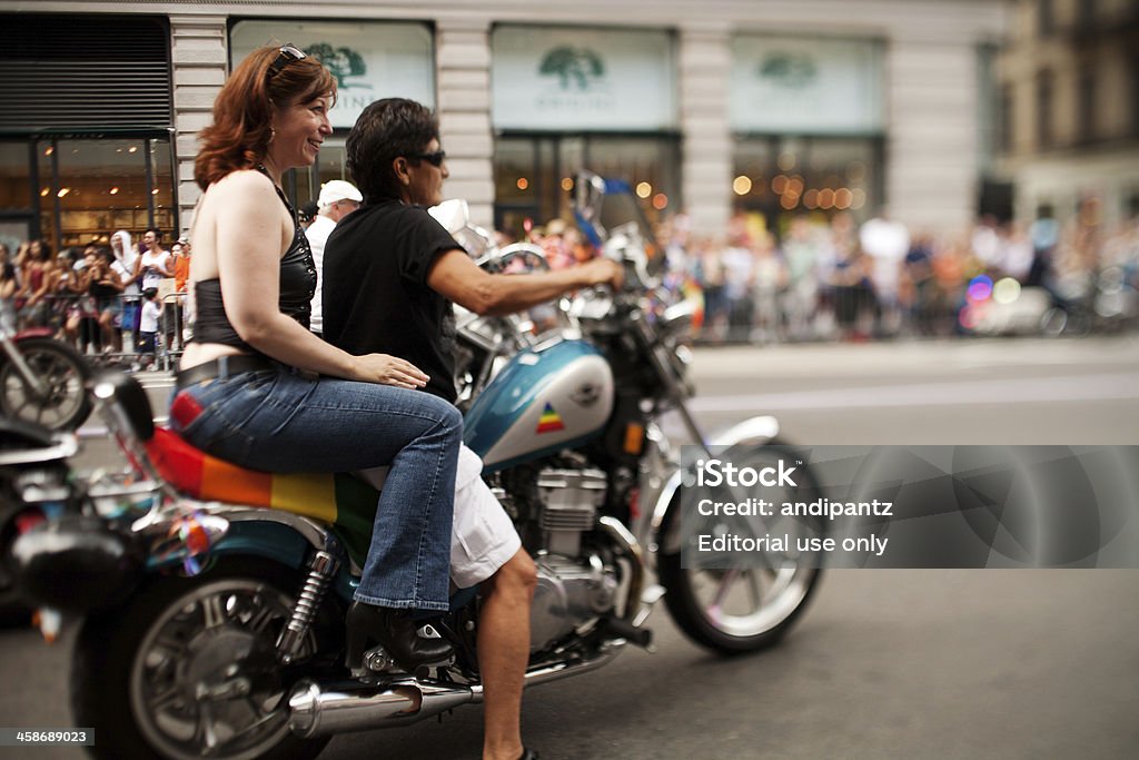 New York Gay Pride March New York City, New York, USA - June 28, 2009: Two women ride a motorcycle in the 2009 Gay Pride march in Manhattan. The New York City Gay Pride March is the oldest gay pride parade in the world, dating back to 1970. 2009 Stock Photo