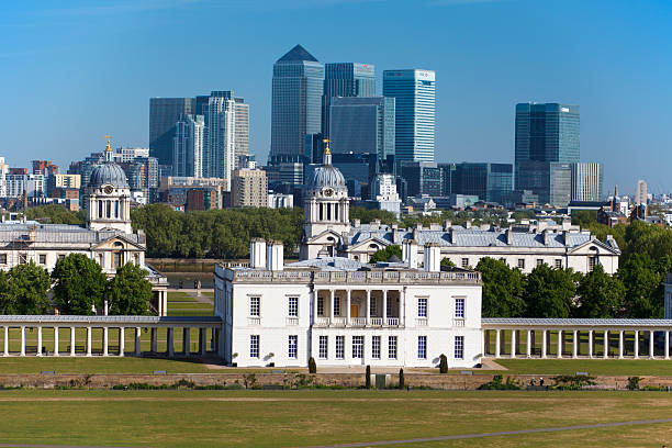 Greenwich, London London, United Kingdom - May 2, 2011: daylight cityscapeThe National Maritime Museum, Royal Naval College, and the Queen\'s House at Greenwich. Docklands and Canary Wharf is in the background.daylight cityscapeLondon, United kingdom queen's house stock pictures, royalty-free photos & images