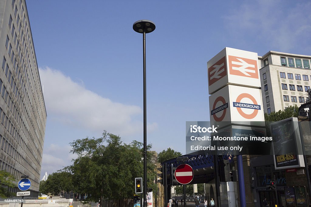 Waterloo in London, England "London, England - August 26, 2013: The National Railway and Underground signs of London Transport outside Waterloo Station. A view towards the City of London from the station platform at Waterloo. To the left are office buildings." Architectural Feature Stock Photo