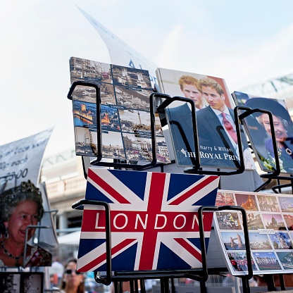 London, United Kingdom - October 1, 2011: Various iconic London themed postcards for sale on a display rack at Covent Garden in central London. The cards picture members of the Royal Family and images of London.
