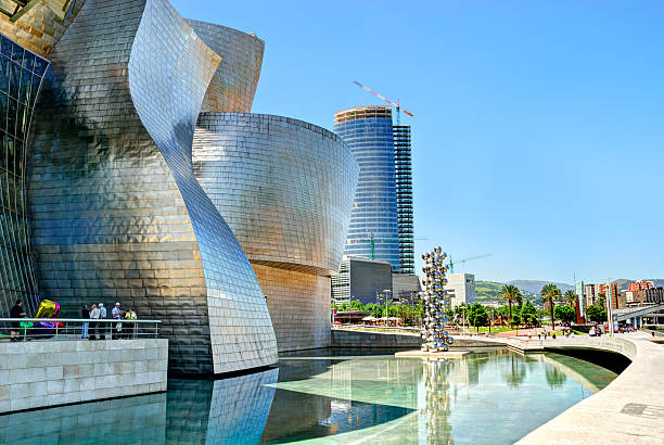 Guggenheim Museum Bilbao, Spain "Bilbao, Spain - June 03, 2010: Guggenheim Museum Bilbao, designed by Canadian-American architect Frank Gehry, is one of the most admired works of contemporary architecture." frank gehry building stock pictures, royalty-free photos & images