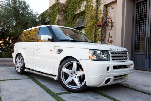 Scottsdale, United States - January 31, 2012: A photo of a parked white Range Rover SUV. The Range Rover although designed for off road use, has become popular as a luxury street vehicle.