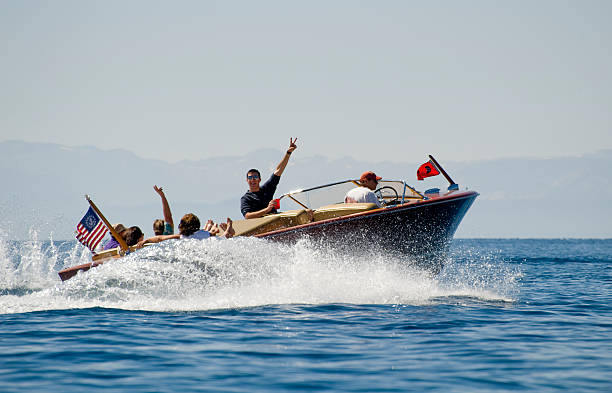 South Lake Tahoe, CA, USA - August 16, 2009:  Restored wooden Chris Craft from the 1950's cruises across Lake Tahoe. Lake Tahoe has one of the largest active wooden boat associations in the country.