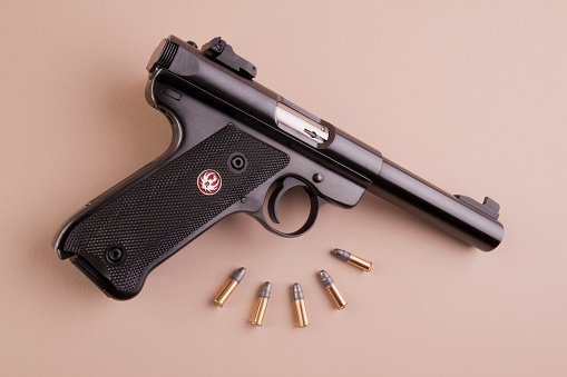 Kirksville, Missouri, United States - November 21, 2012: Ruger Mark III target pistol. Image shows the .22 caliber pistol at an angle with target ammo.