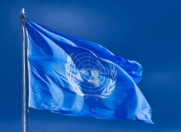 United Nations flag. Pristina, Serbia - February 2, 2007: United Nations flag. The United Nations (UN) is an international organization whose stated aims are facilitating cooperation in international law, international security, economic development, social progress, human rights, and achievement of world peace. united nations flag stock pictures, royalty-free photos & images