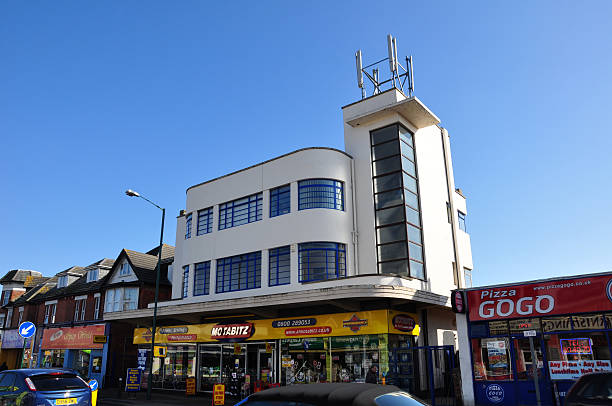 Art Deco Bosombe Bournemouth, UK - March 6, 2011: An Art Deco building with shops underneath and traffic passing by. In the Boscombe district of Bournemouth. boscombe photos stock pictures, royalty-free photos & images