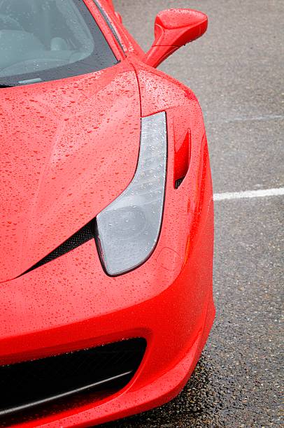 Zandvoort, The Netherlands - June 24, 2012: Red Ferrari 458 Italia front view. The car is covered with raindrops. The car is on display during the 2012 Italia a Zandvoort day.