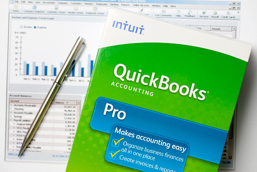 San Marcos, USA - July 5, 2011: QuickBooks box on graphs. Quickbooks is an accounting software program created by INTUIT corporation. It is the most popular accounting software program for small business with over 90% market share.