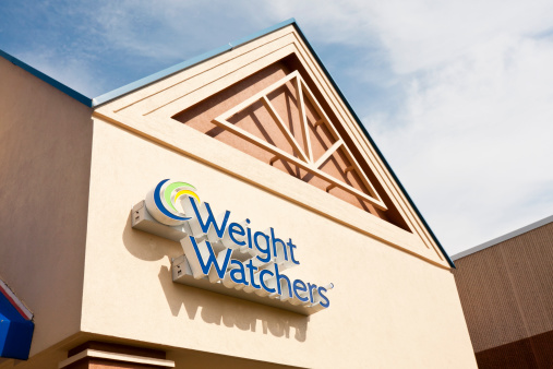 Arlington Heights, IL, USA - August 5, 2011:  Sign at Weight Watchers business in a strip mall.  Weight Watchers concentrates on teaching people to lose weight by eating right and living a healthy lifestyle.