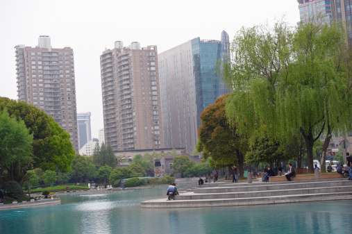 Shanghai, China - April 21, 2011: people relaxing in Taipingqiao Park in Luwan district.