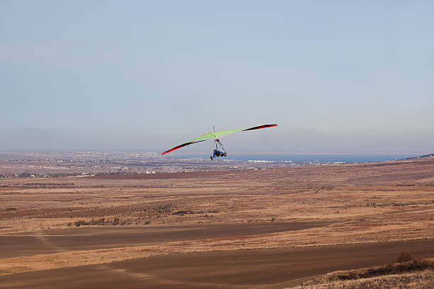 Hang glider in flight stock photo