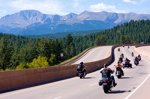 Woodland Park, Colorado, USA - August 20, 2011: Motorcycle parade on westbound highway 24 at the base of Pikes Peak Colorado to kick off the 19th annual Salute to American Veterans Rally.