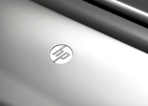Vancouver, Canada -- August 7, 2011:Close up of the Hewlett-Packard logo on a printer.  HP is an American information technology company.