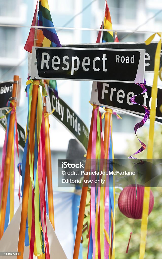 Respect Road Sign Vancouver, British Columbia, Canada - July 31, 2011: Signs with the words &amp;amp;amp;amp;amp;amp;amp;ldquo;Respect Road&amp;amp;amp;amp;amp;amp;amp;rdquo;, &amp;amp;amp;amp;amp;amp;amp;ldquo;City Pride Place&amp;amp;amp;amp;amp;amp;amp;rdquo; and part of &amp;amp;amp;amp;amp;amp;amp;ldquo;Free to Be&amp;amp;amp;amp;amp;amp;amp;rdquo;, streamers, ribbons, pride flags, and lanterns in rainbow colours decorate a float at the Vancouver Pride Parade on July 31, 2011.  The annual Vancouver Pride Parade is Western Canada&amp;amp;amp;amp;amp;amp;amp;rsquo;s largest celebration of the LGBTTQ (lesbian, gay, bisexual, transgender, transsexual, transvestite, queer, questioning) community and is in its 33rd year drawing over 600,000 spectators.  This image was taken on Robson Street, Vancouver, British Columbia, Canada, along the parade route. City Stock Photo