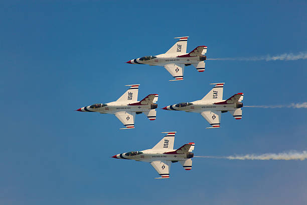 USAF Thunderbirds "Ocean City, USA - June 4, 2010:  United States Air Force Thunderbirds Demonstration Squadron flying in formation presentic characteristics od F-16 Fighting Falcon pinted in the famous blue red and white color which are also colors of the Flag of the United States of America" supersonic airplane editorial airplane air vehicle stock pictures, royalty-free photos & images