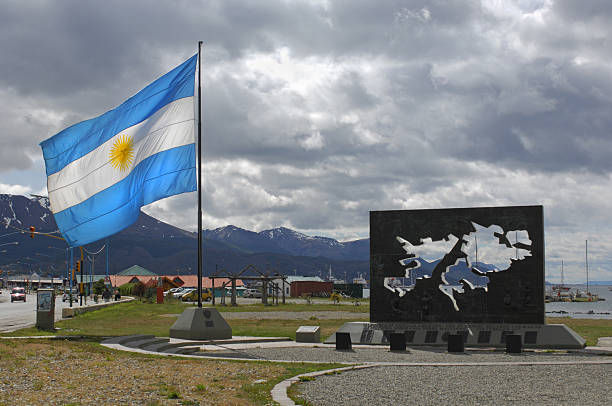 Falklands Memorial Ushuaia, Argentina - December,10th 2006:The public memorial to the Argentinian soldiers of the Falklands (Malvinas) War - the memorial has a cut out map of the islands and a Argentinian flag falkland islands stock pictures, royalty-free photos & images
